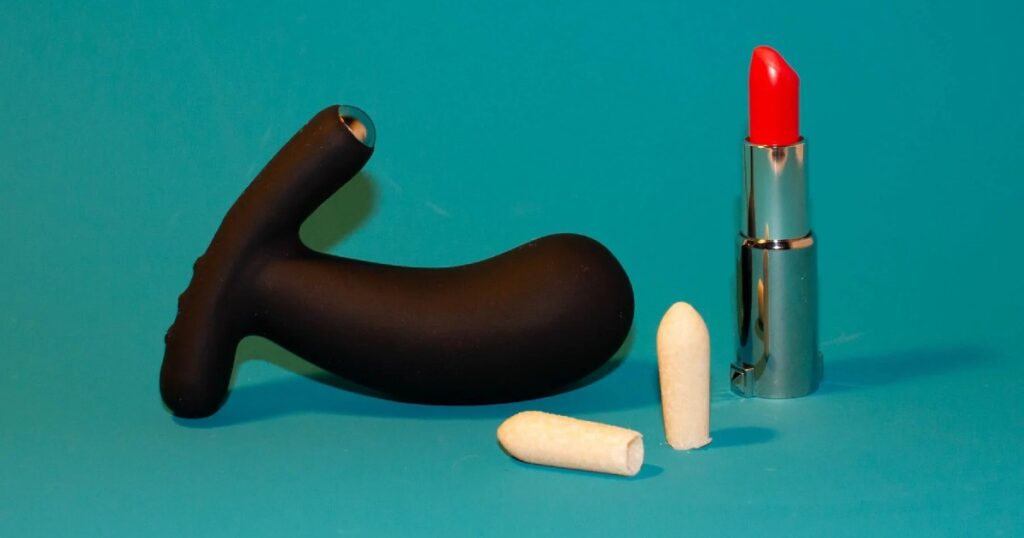 Mello Bottoms CBD suppositories are shown with butt plug and open red lipstick. They are one of several cannabis sex products available to buy in Canda. 